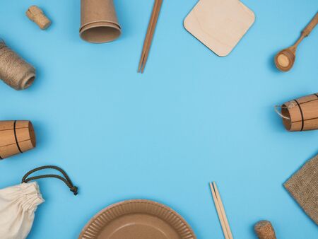 Items, kitchen and household made of ecological materials on a blue background. The view from the top. Natural raw materials. The concept of recycling. Biodegradable materials.の写真素材