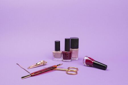 Set for care of nails on a violet background.  Women's accessories.の写真素材
