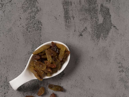 Delicious raisins on a gray background.The view from the top.の写真素材
