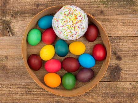 Bright Easter round still life on a wooden background.の写真素材