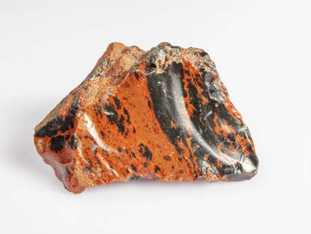 Obsidian mahogany. Igneous rock. White background. Magma glass.の写真素材