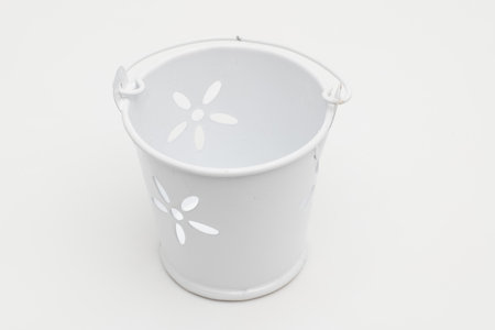 Miniature decorative bucket close-up on a white background.の写真素材