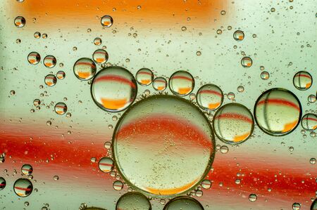 Oil in water, colored background, abstract pictureの写真素材