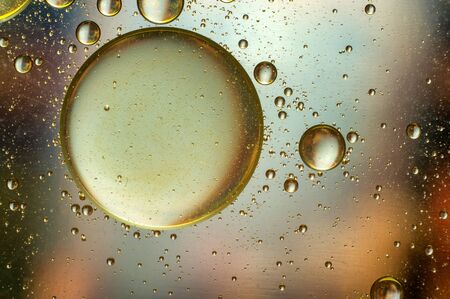 Oil in water, colored background, abstract pictureの写真素材