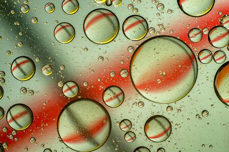 Oil in water, colored background, abstract pictureの写真素材