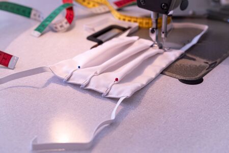 Manufacture of washable masks for face protection against viruses, allergies, epidemics and global pandemics.の写真素材