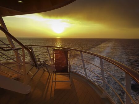 Sunset in the wake of a cruise ship.