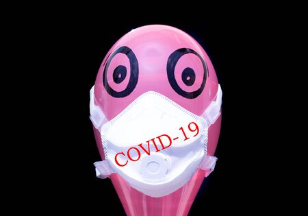 FFP2 mask for facial protection against viruses, allergies, epidemics and global pandemics. To fight against the coronavirus, with Covid-19 marking.の写真素材