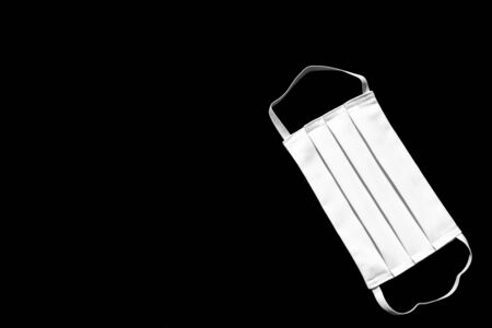 Mask for protecting the face against viruses, allergies, epidemics and global pandemics. To fight against the coronavirus, COVID-19.の写真素材