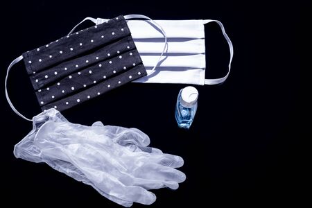Masks, gel and gloves for protection against viruses, allergies, epidemics and global pandemics. To fight against the coronavirus, COVID-19.の写真素材