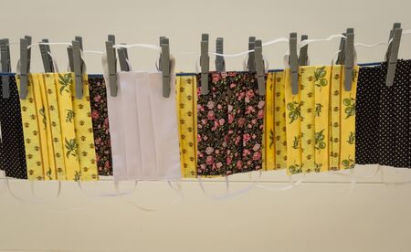 Protective masks for the face on a drying rack for drying after washing. Manufacture of washable...