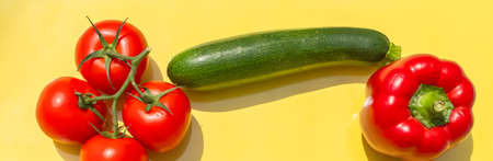 Creative presentation of seasonal summer vegetables with tomatoes, zucchini. On background to include text.の素材 [FY310152291535]