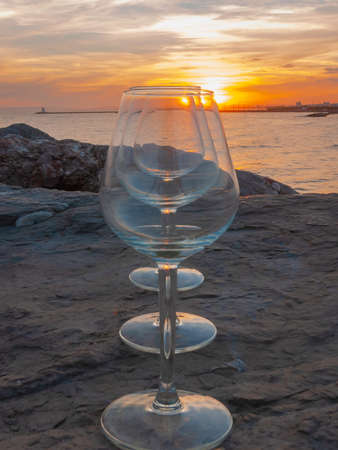 Sunset over La Grande Motte, Herault, France. Stemmed glasses.の写真素材