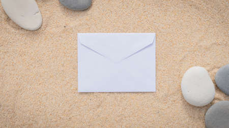 Sea sand grains background, fine beach sand with shell and pebbles. Place for text on paper.