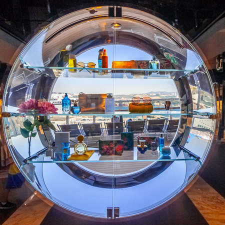 View of a perfume display case in a porthole of the cruise ship MSC Seaview, overlooking the port of Marseille, France, June 30, 2018.のeditorial素材