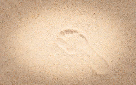 Bare foot print in beach sand.の写真素材