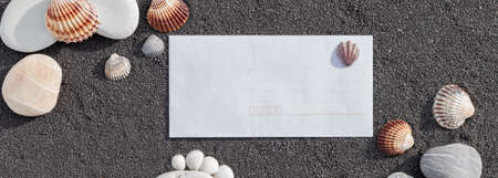 Sea sand grains background, fine beach sand with shell and shells. Place for text on paper.