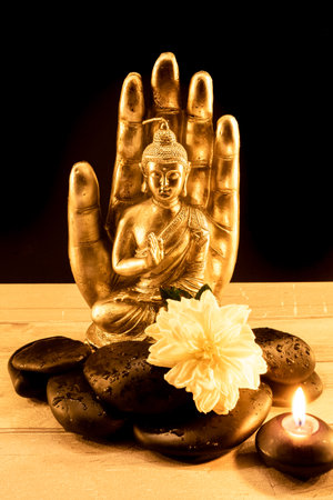Buddha statue on black background.の写真素材
