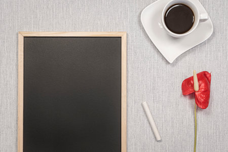 Slate blackboard template with empty space for logos, advertising lettering. Frame on a workspaceの写真素材