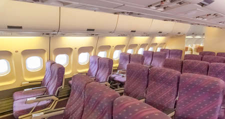 Armchairs inside an airliner.