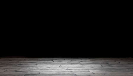 Black background with brick stand for presentation of advertising items for product promotion. Embossed ground appearance, plain black background.の写真素材