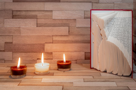 Relaxing and zen atmosphere with candles and a blossoming almond branch.の写真素材