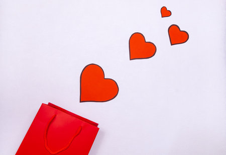 Romantic composition for Valentine's Day, declaration of love, Mother's Day, birthday, engagement. Red hearts with a gift box. Vector icon.の写真素材