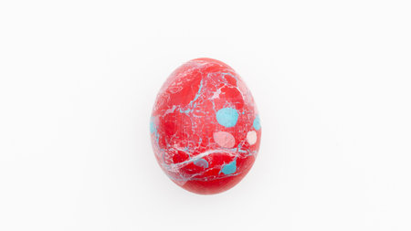 Decorated easter egg on white background, top view.の写真素材
