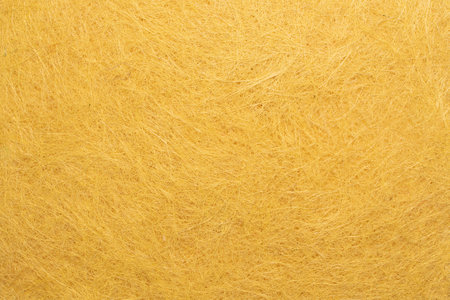 Close up of yellow wool wool texture background. Wool woolen texture.の写真素材