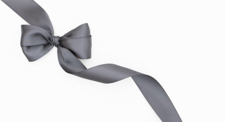 Black silk ribbon bow isolated on white background with copy space for your text.の写真素材