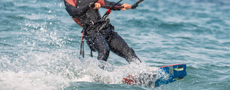 Kitesurfer in action on the sea. Extreme water sport.