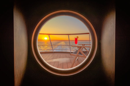 View from the window of a cruise ship on the sea and the sunset.の写真素材