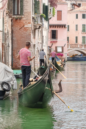 Gondoliers in Venice, Italyの写真素材