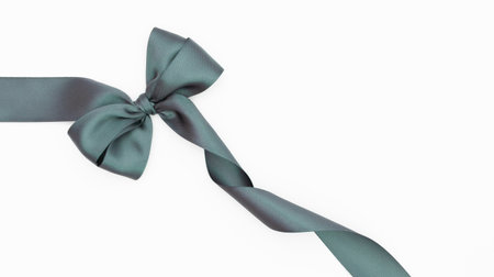 Green satin ribbon bow isolated on white background, clipping path includedの写真素材