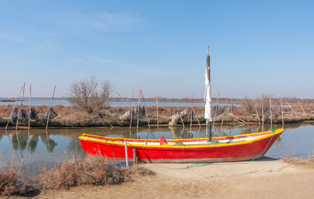 Fisherman's boat on a pond of the Camargue, protected natural reserve.の写真素材