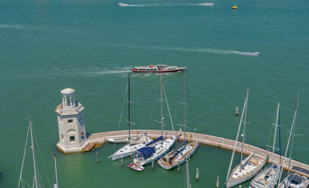 Aerial view of a sailing boat in the harbor of Venice, Italy.の写真素材