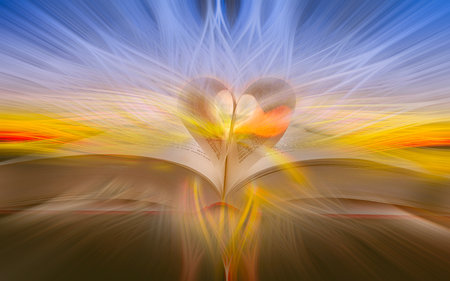 abstract background of the pages of a book curved into a heartの写真素材