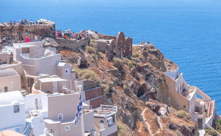 Tourists visiting the picturesque island of Santoriniの写真素材