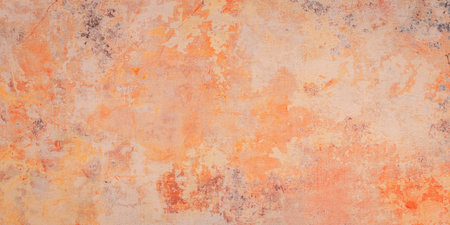 Texture of old rustic wall covered with orange stucco, backgroundの写真素材