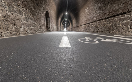 Bicycle lane in a tunnel. 3D rendering. Long exposure.の写真素材