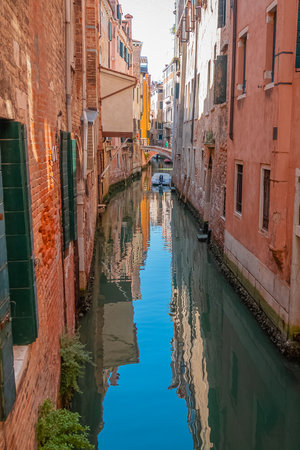 View of the narrow canal in Venice, Italyの写真素材