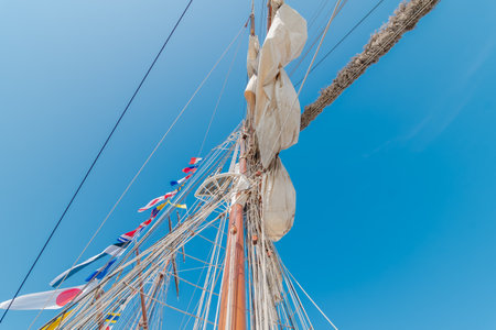 masts of a tall ship against the blue sky, close-upの写真素材
