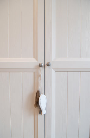 White wooden door with handle and keyhole, closeup of photoの写真素材