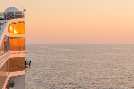 Cruise ship in the sea at sunset, view from the deckの写真素材