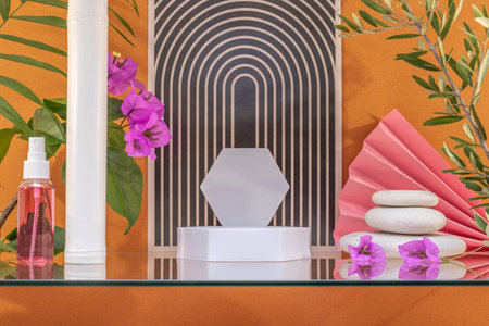 White podium for product presentation in the bathroom with flowers and leaves.の写真素材