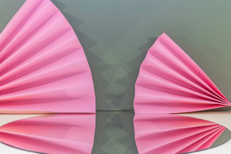 Paper origami fan on the background of the wall. 3d renderingの写真素材