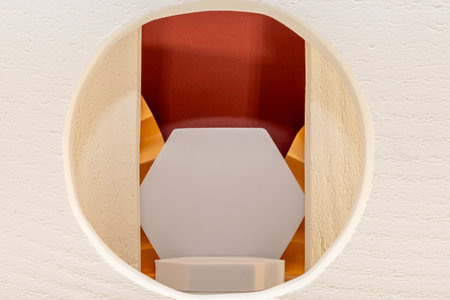 3d rendering of a hexagon podium in a white room with white wallsの写真素材