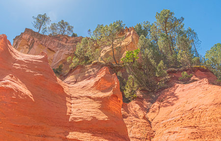 Colorful sandstone cliffs in Roussillon, Provence, France
