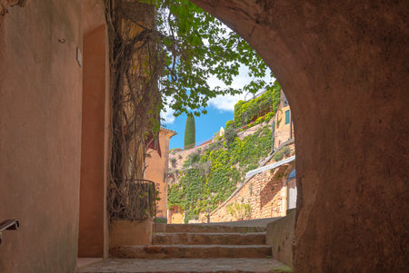 View of a narrow street in the old town of Roussillon, Provence, Franceの写真素材