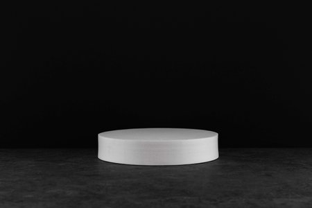 White round podium on black background. Mock up, 3D renderingの写真素材